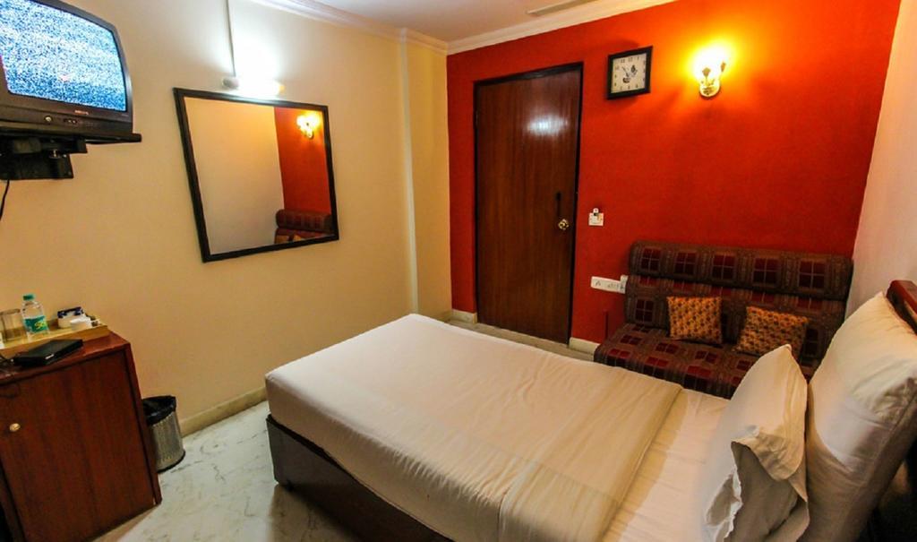 Hotel Pigeon International Бангалор Номер фото