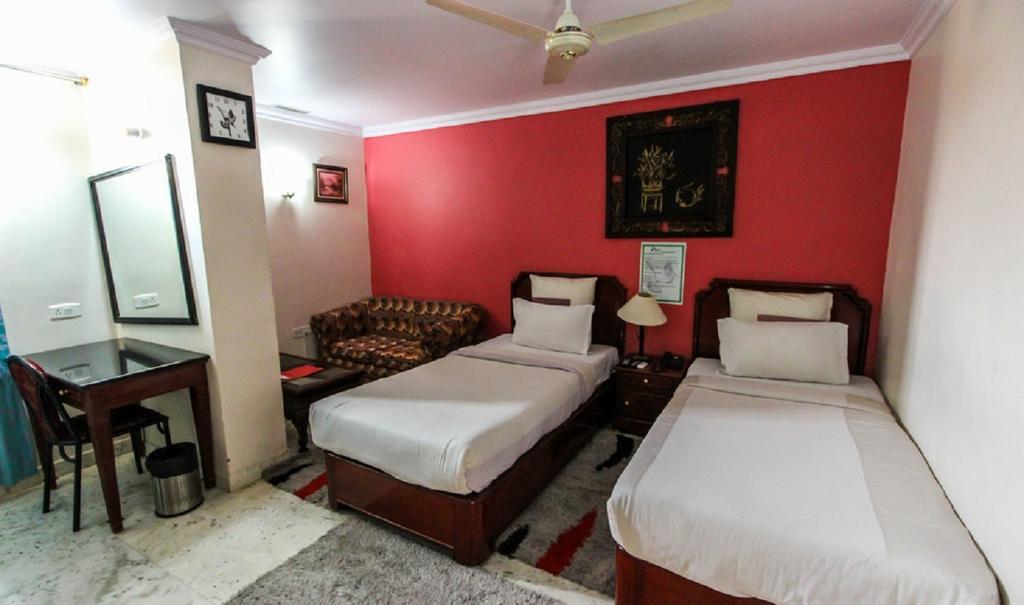 Hotel Pigeon International Бангалор Номер фото